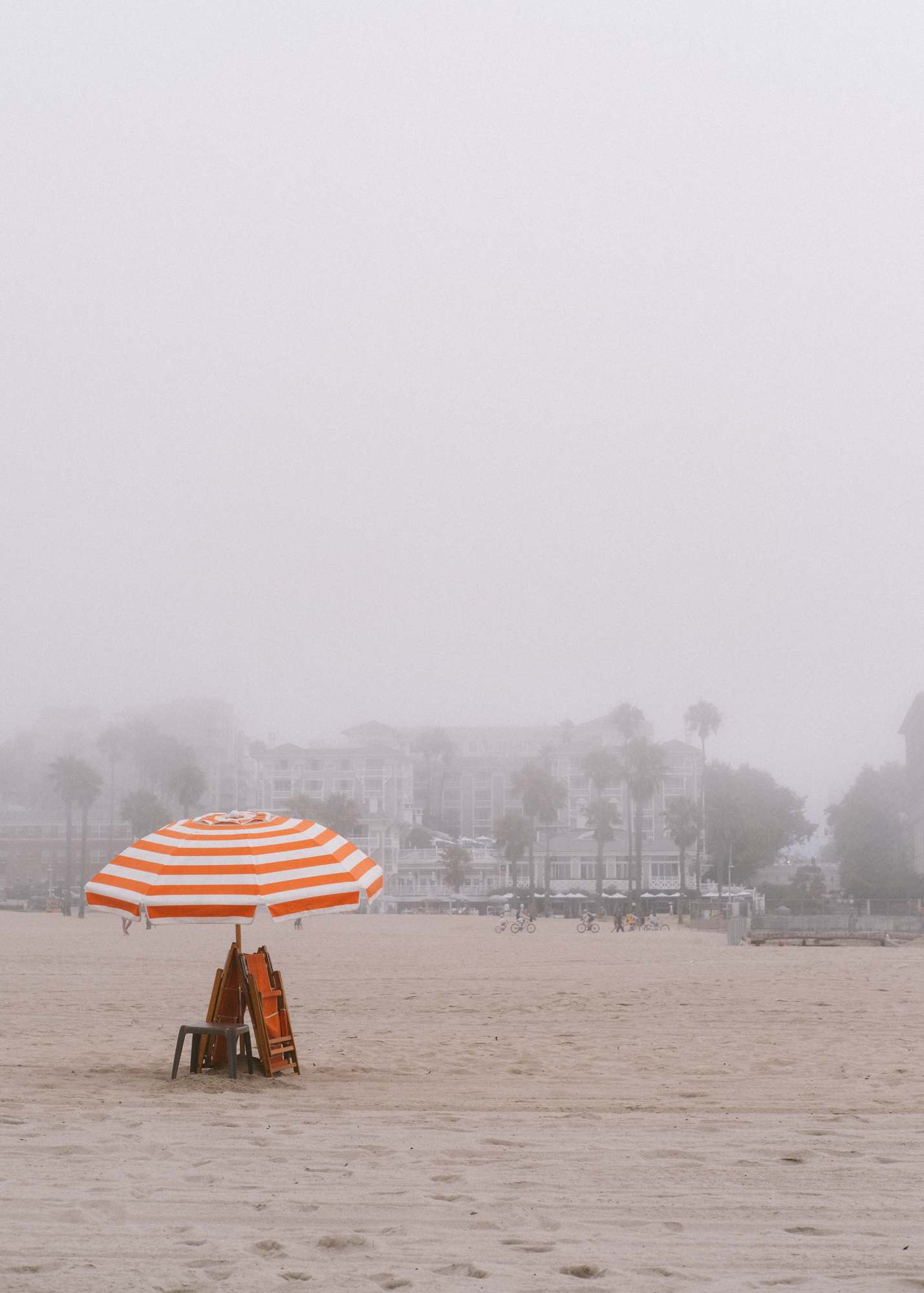 Orange Stripped Beach Umbrella and Chairs