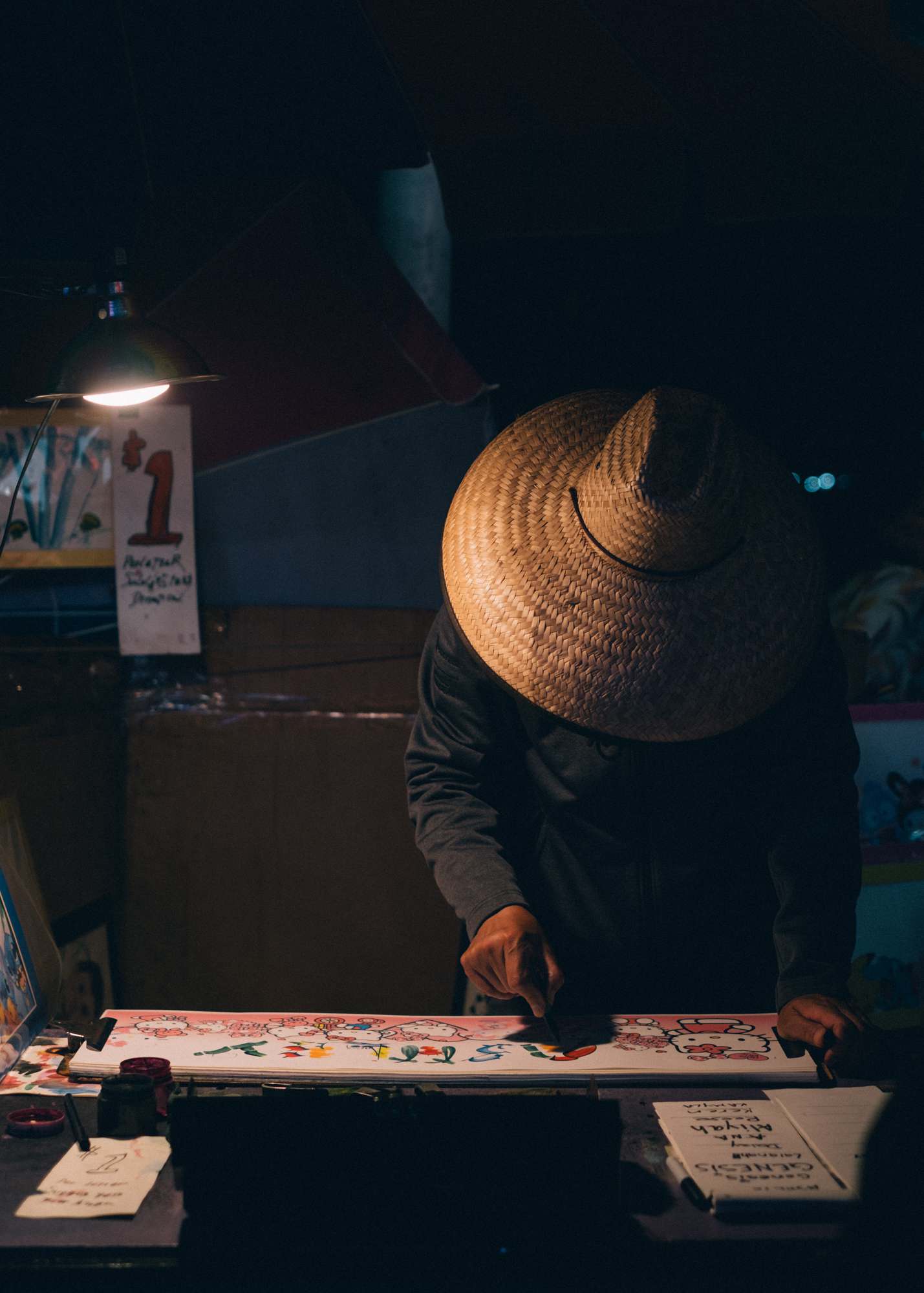 Pier Vendor Creating a Souvenir