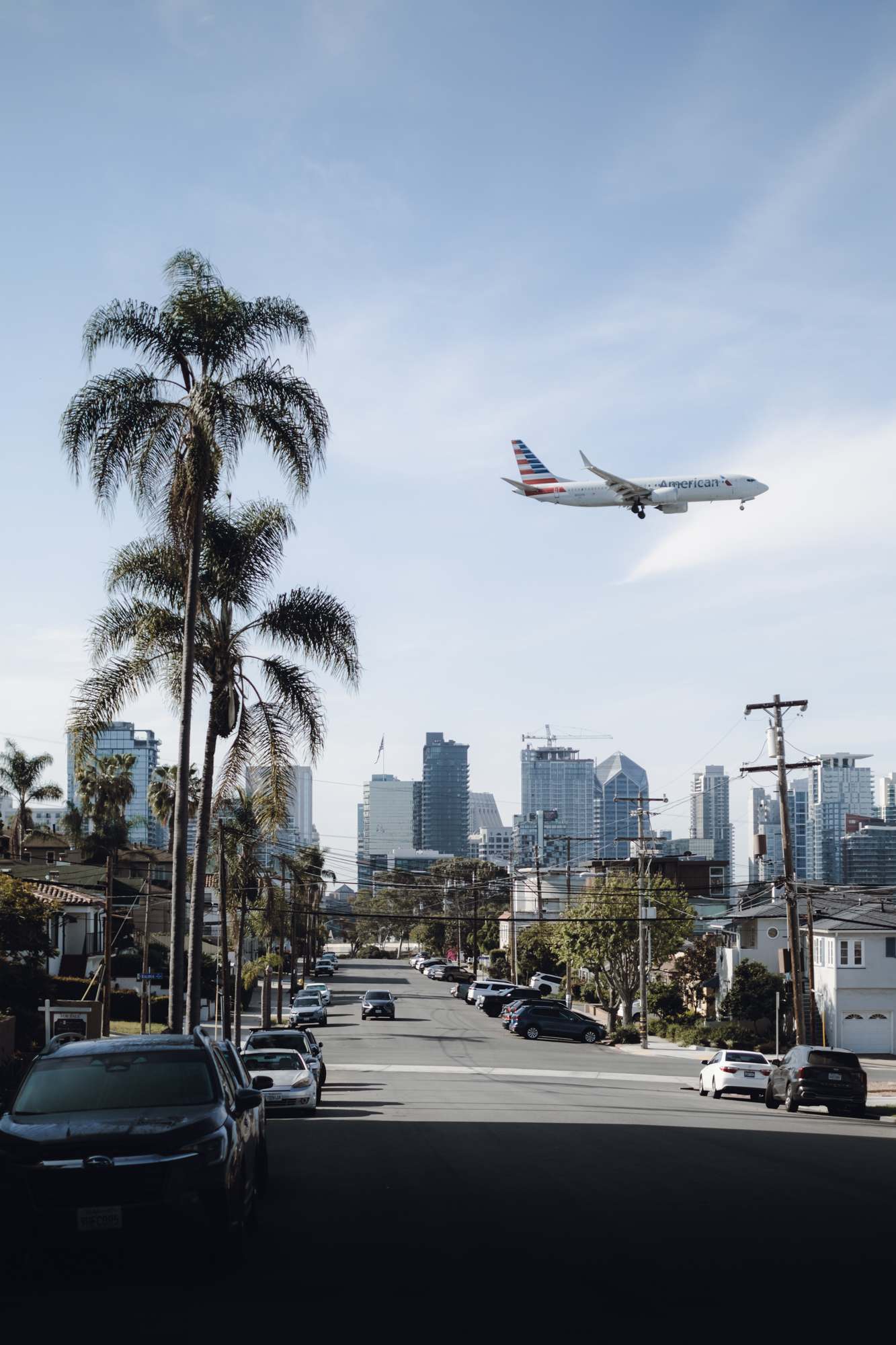 An American Airlines Plane Landing With the San Diego Skyline in the Background